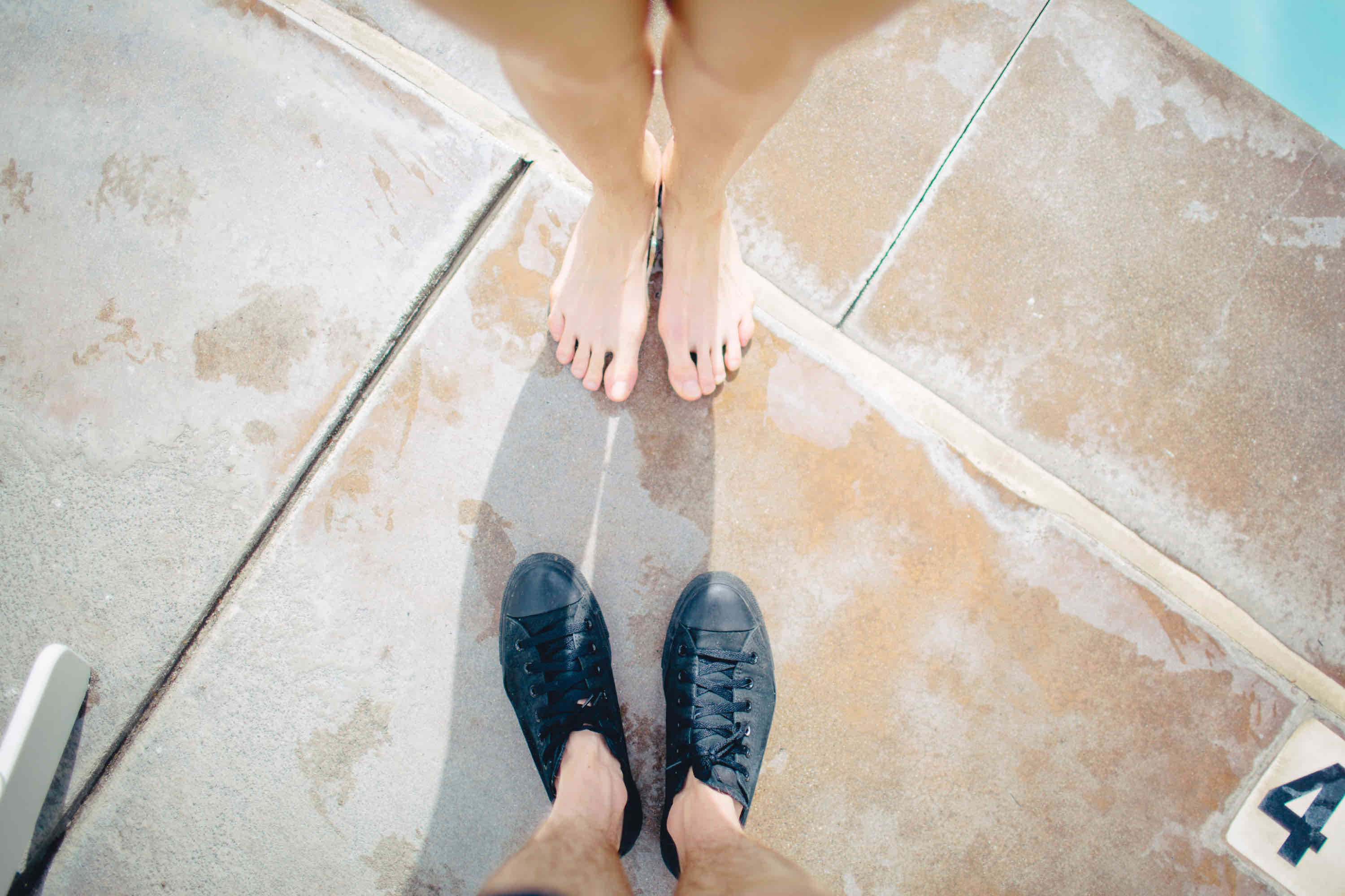 shopping for life insurance as a couple - two pairs of feet facing each other