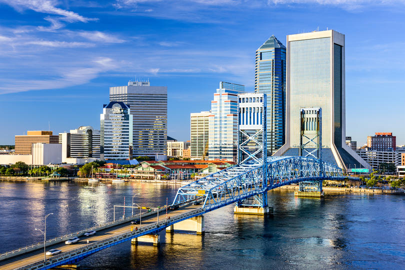 States with the biggest debt problem - Skyline of Jacksonville, FL with the Saint Johns River in the foreground.