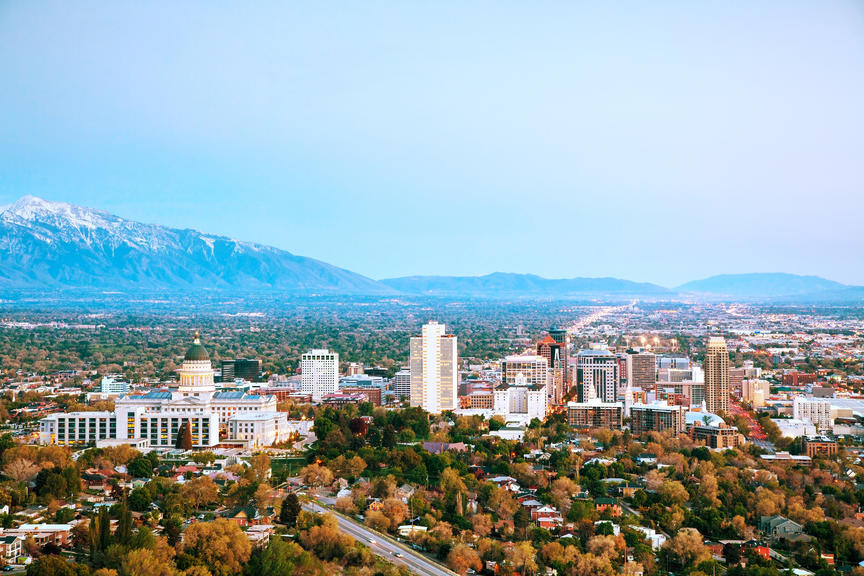 How Much Home Can Millennial Families Afford in These Top Cities? - Salt Lake City skyline with Rocky Mountains in the background. 
