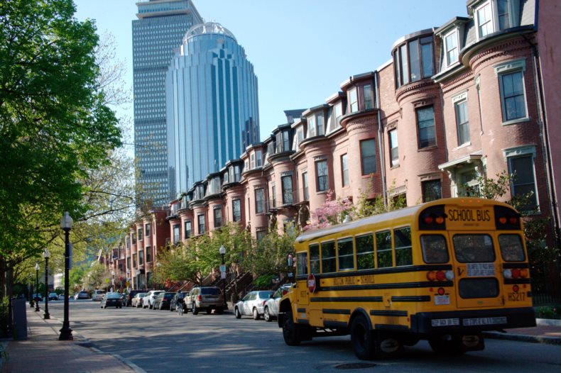 States with the best public schools - street in Boston, MA with school bus.