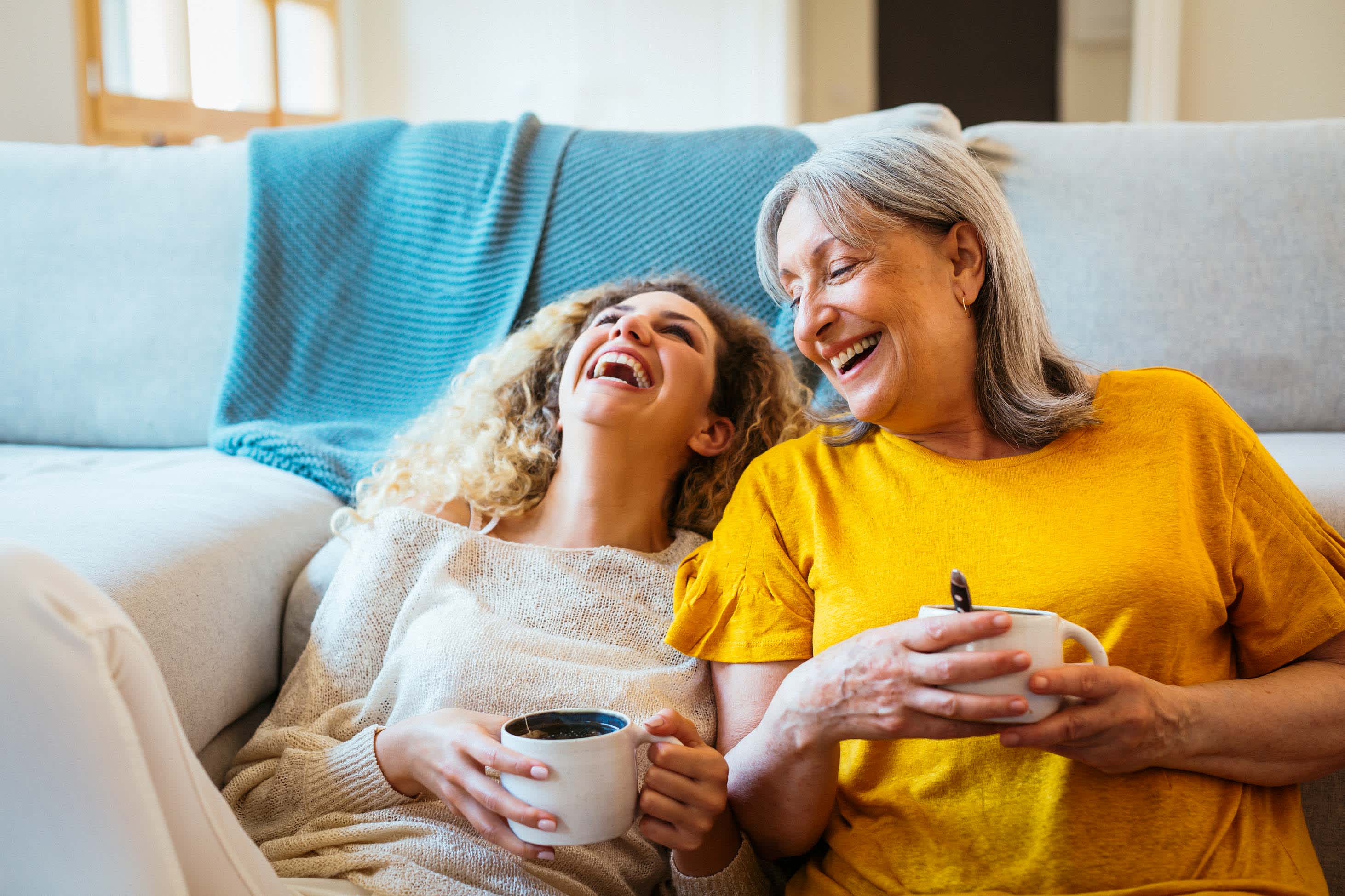 what it means to take out a life insurance policy on someone else - young woman and older woman drinking tea
