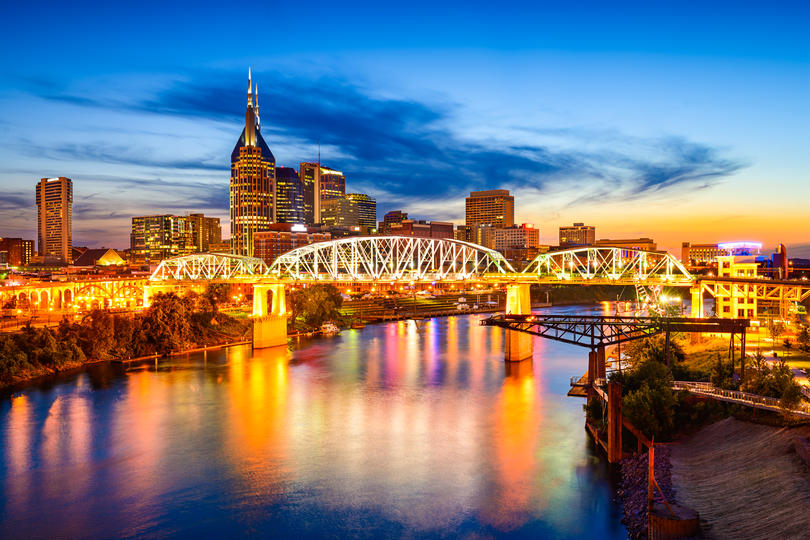 How Much Home Can Millennial Families Afford in These Top Cities? - View of Nashville skyline from the waterfront during dusk. 