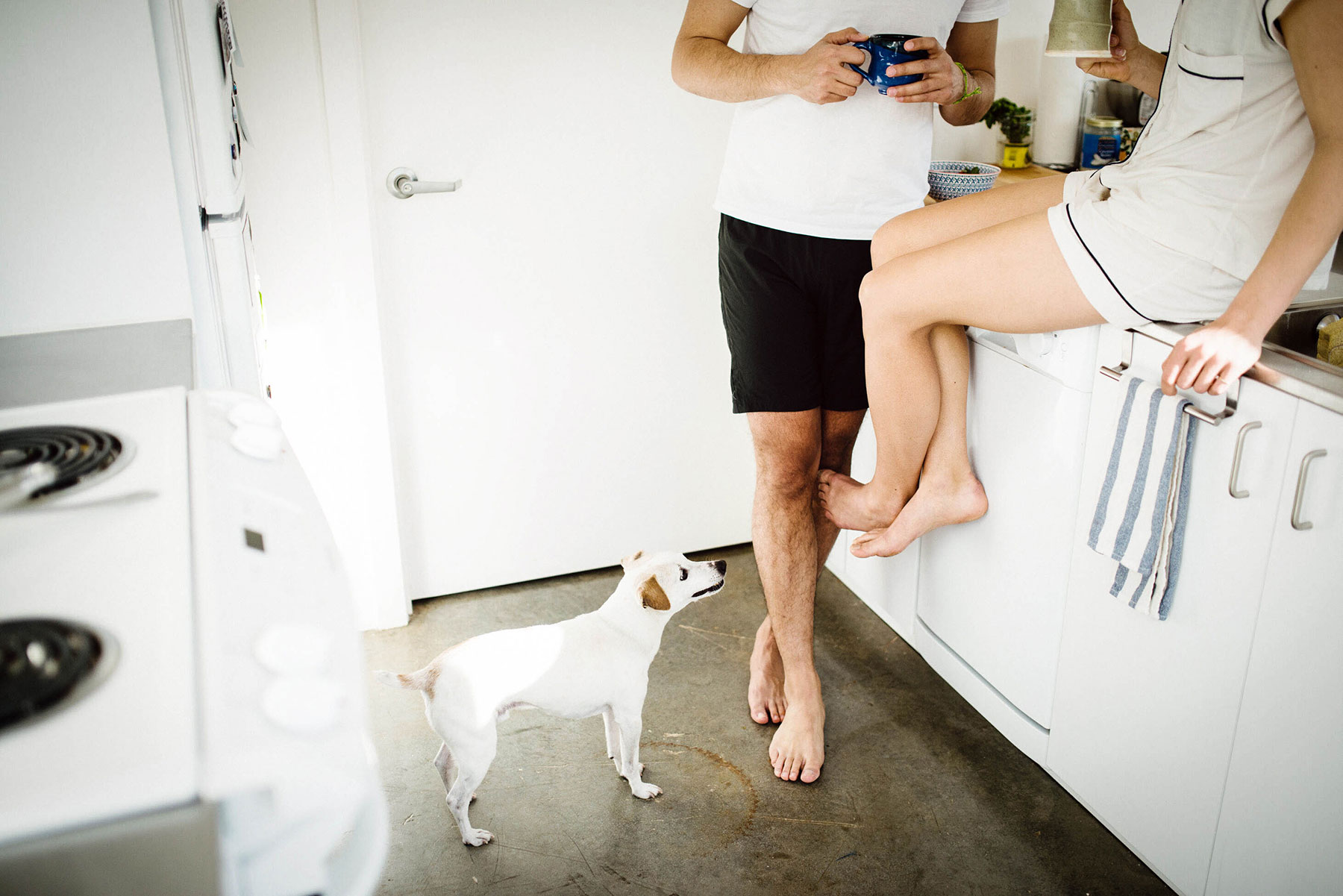 payable on death bank accounts - casual man and woman in pajamas in kitchen with a dog