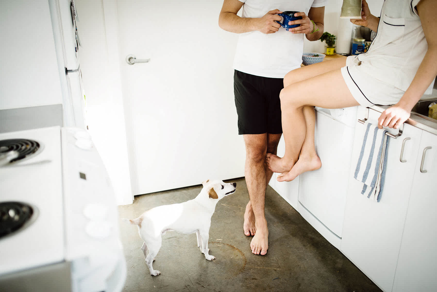 payable on death bank accounts - casual man and woman in pajamas in kitchen with a dog