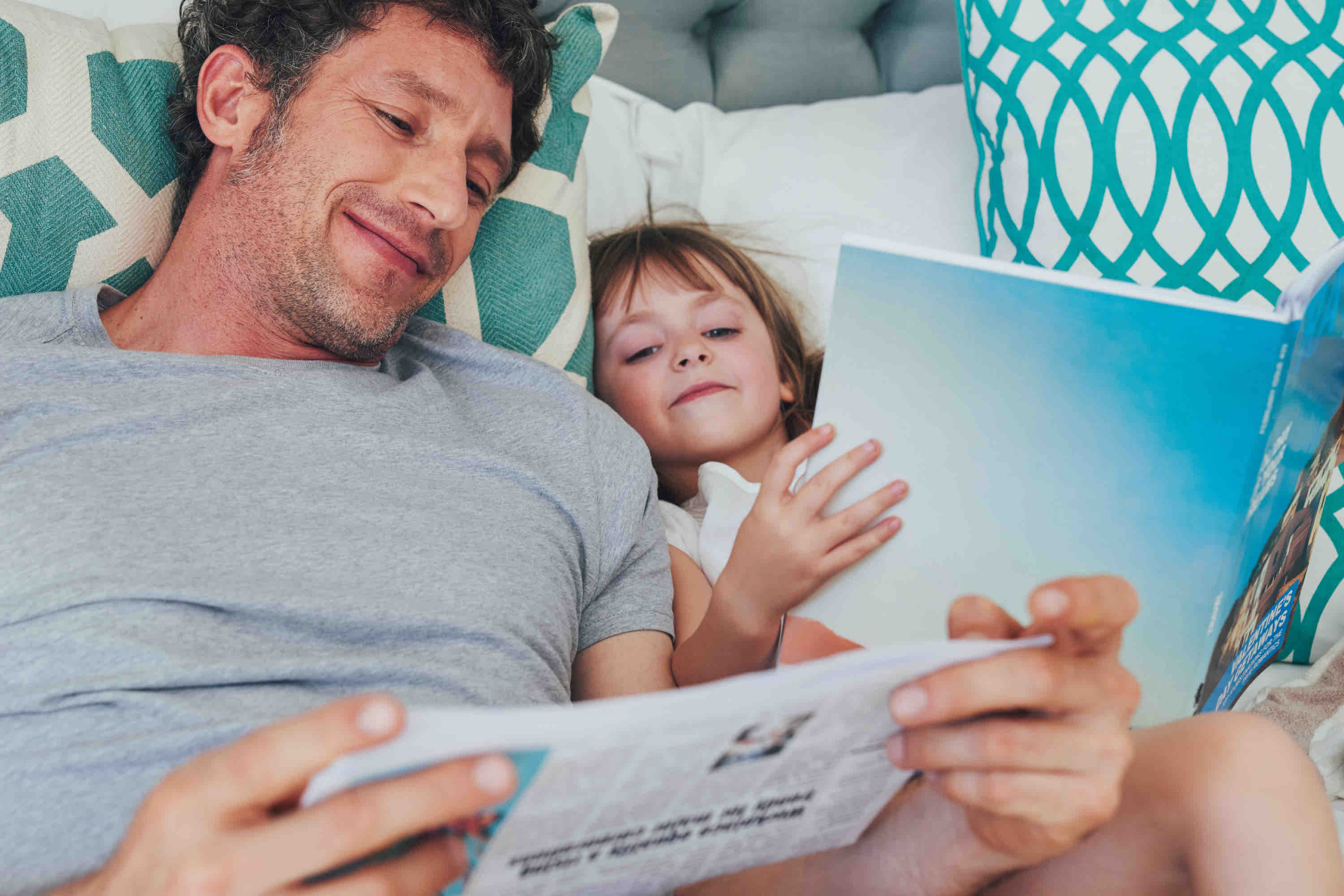 life insurance application annotated with commentary - dad and daughter in bed reading different things