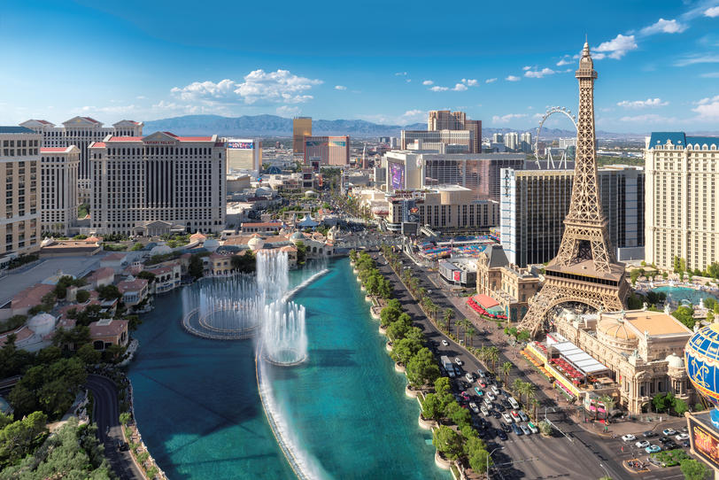 How Much Home Can Millennial Families Afford in These Top Cities? - Birds eye view of Las Vegas strip with the Eiffel Tower and Bellagio Fountain in the foreground. 