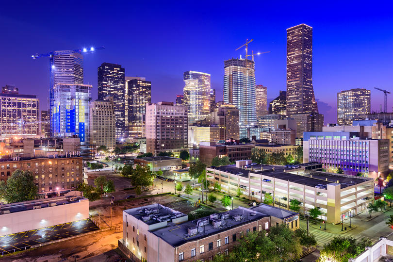How Much Home Can Millennial Families Afford in These Top Cities? - Nighttime view of the downtown Houston Skyline. 