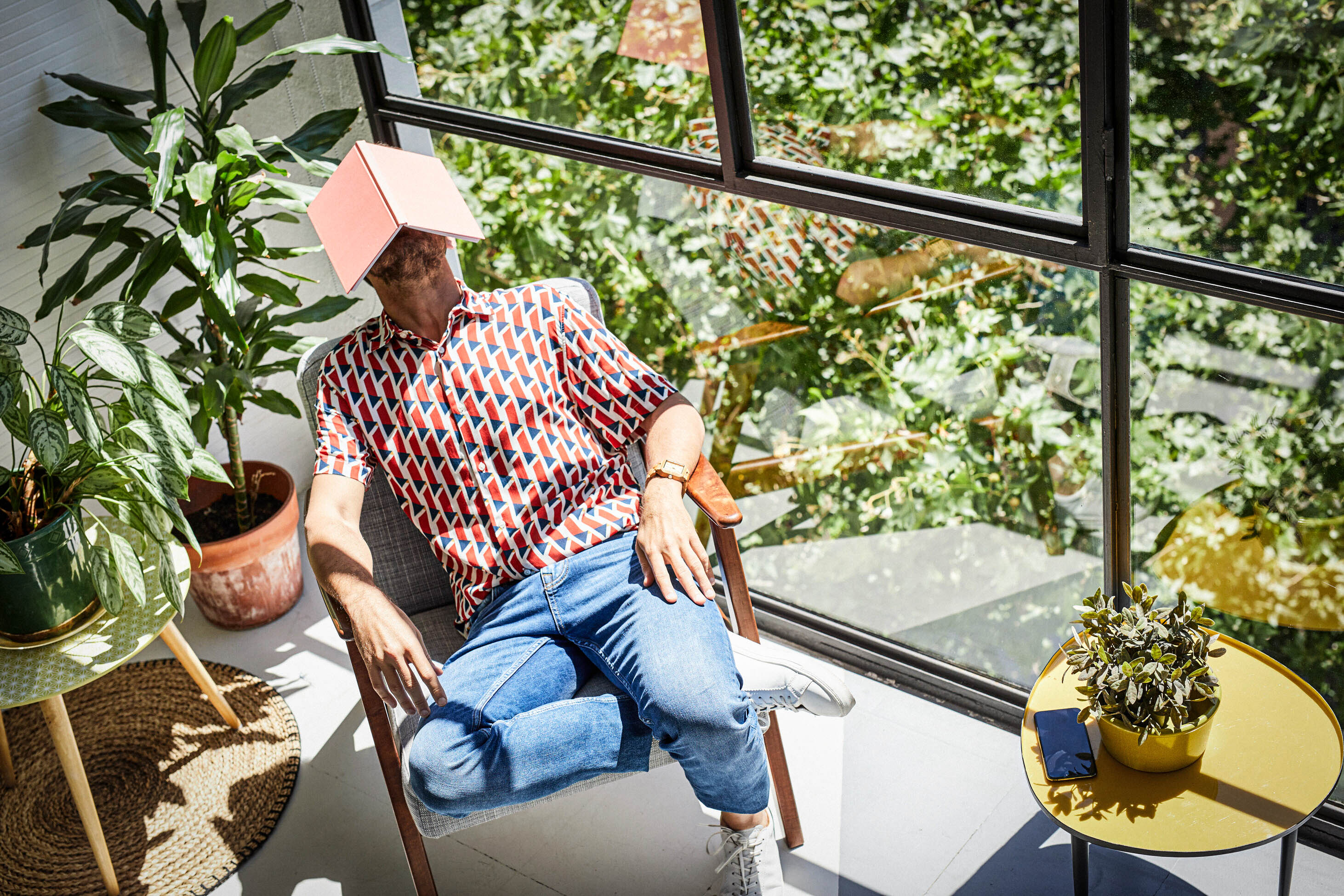 if you have depression or anxiety, can you still get life insurance? life insurance & mental health - man resting in chair with a book over his head