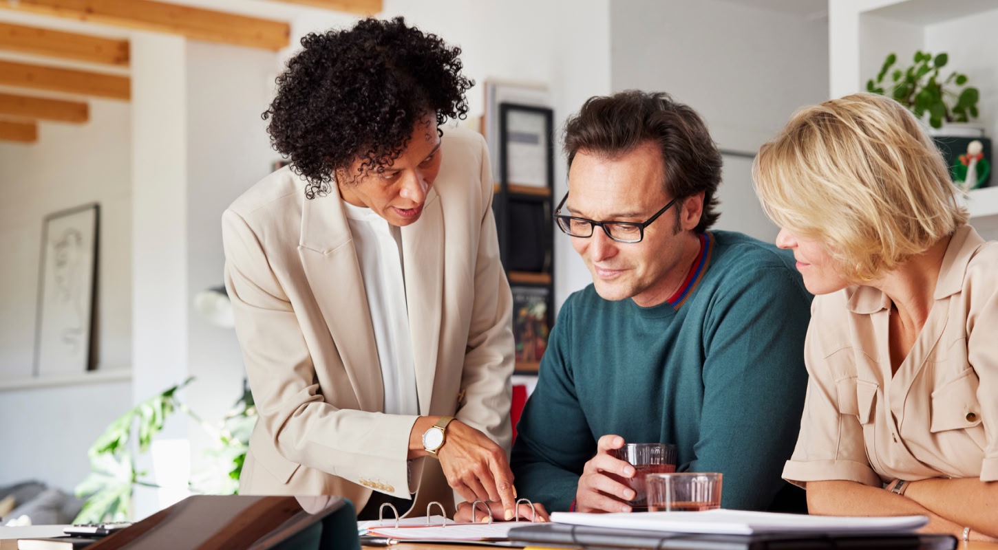 Term life insurance settlement options are explained to a middle-aged couple