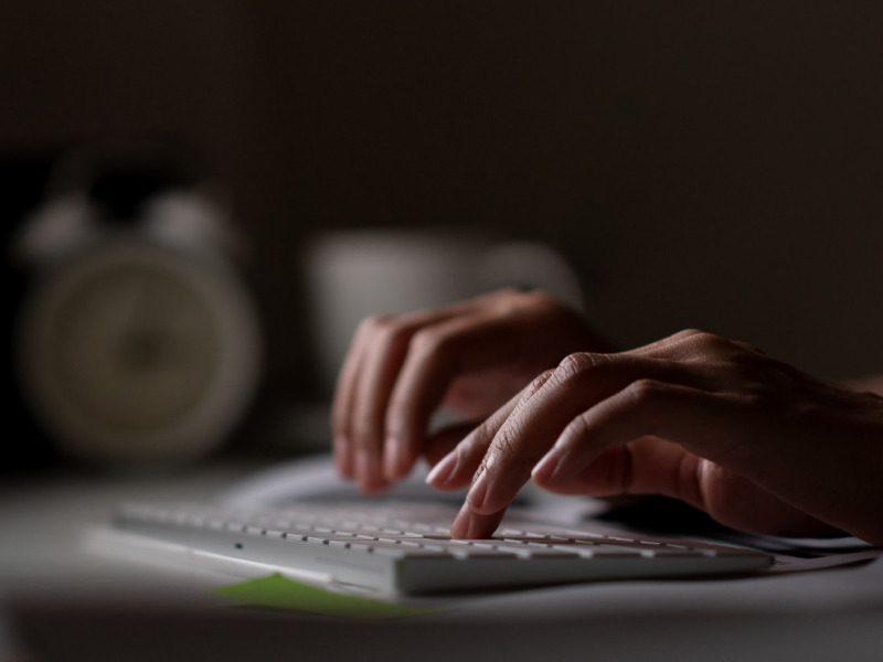 Fingers typing on a keyboard
