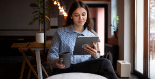 A woman checking her tablet