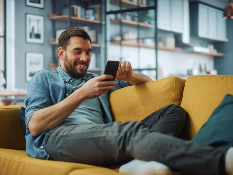A guy checking his mobile phone