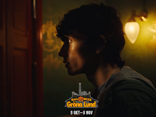 A person with curly hair stands in profile, illuminated by warm lighting, with Halloween Gröna Lund event details at the bottom: “9 OKT – 8 NOV”.