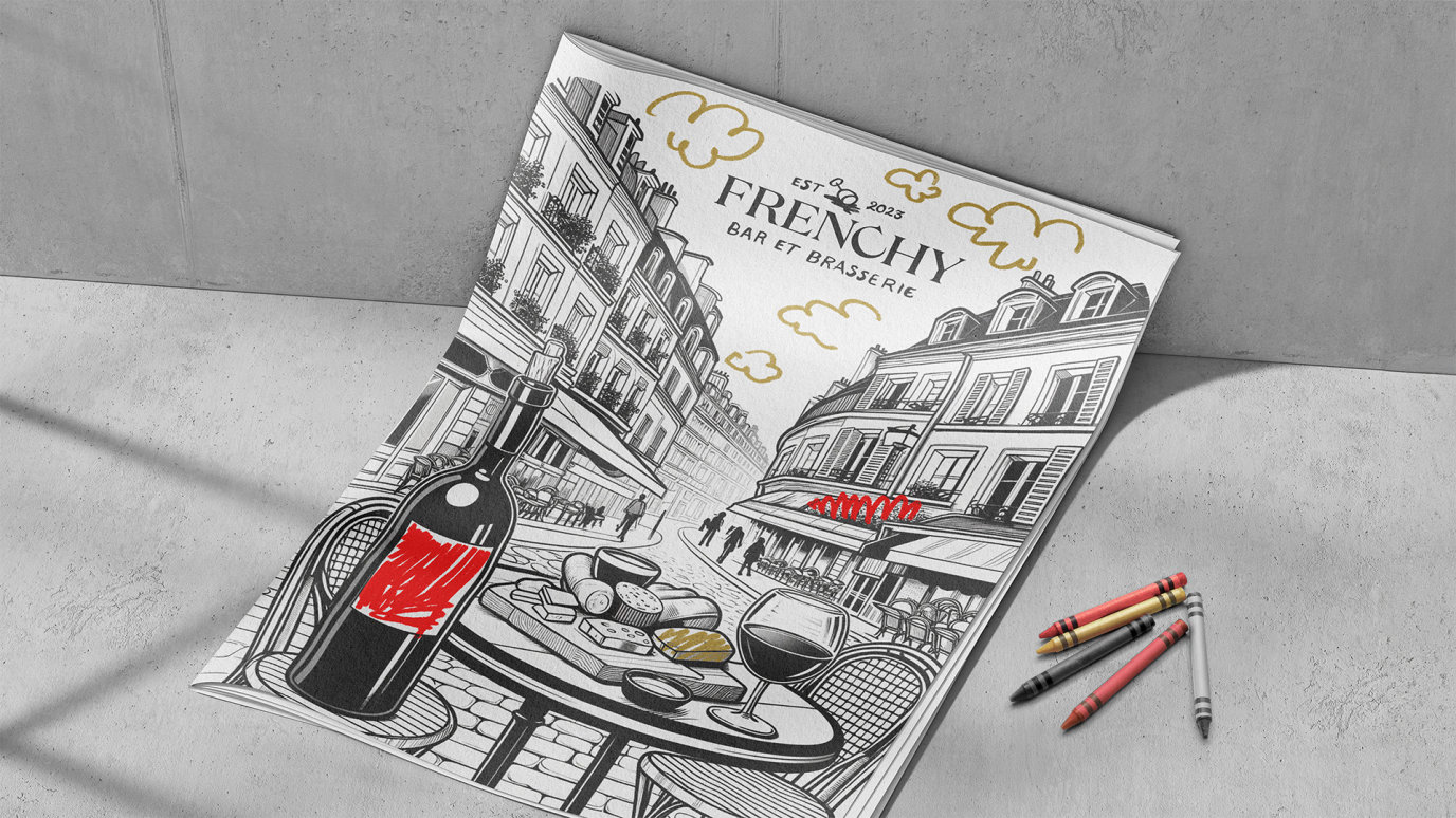 A sophisticated Frenchy branded colouring book with Frenchy branded crayons beside it, for children staying at the hotel and dining at Frenchy.
