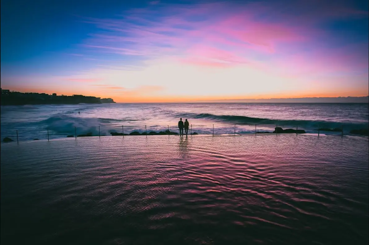 two people in the middle of the ocean