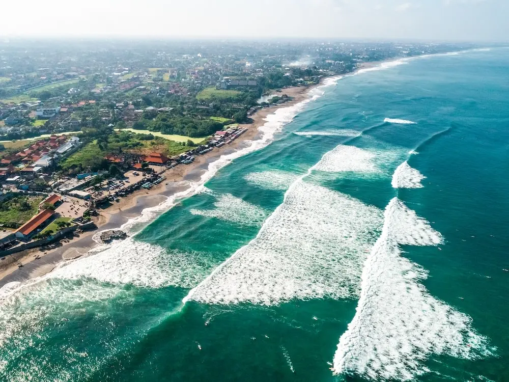 Waves crashing along the rugged Canggu coast in Bali.