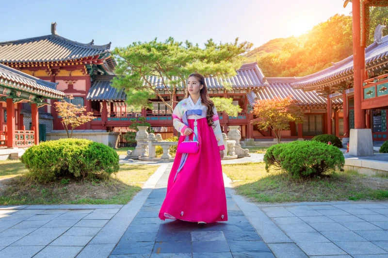 woman posing in pink Hanbok-pelago