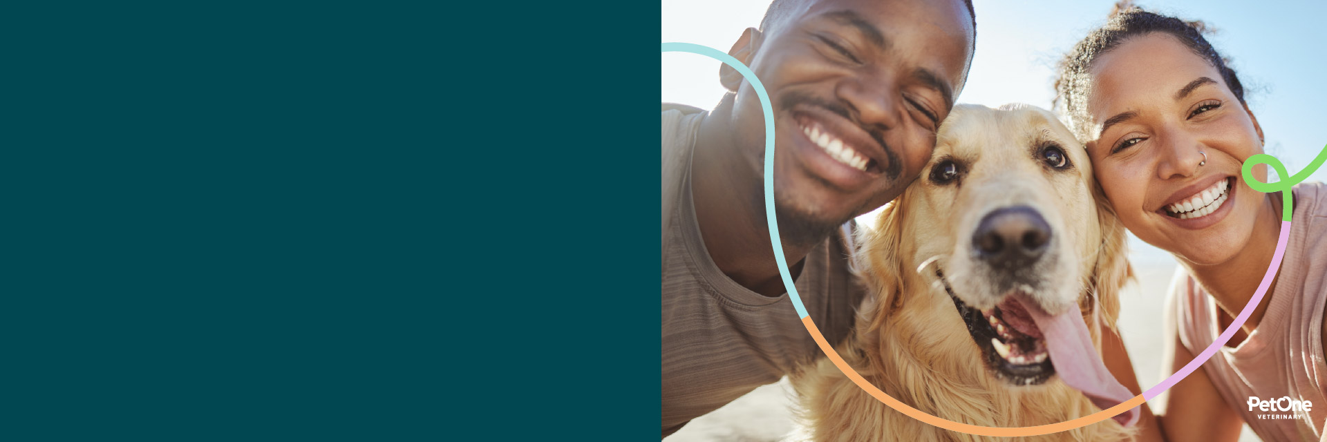 A man and woman outside smiling together with a dog