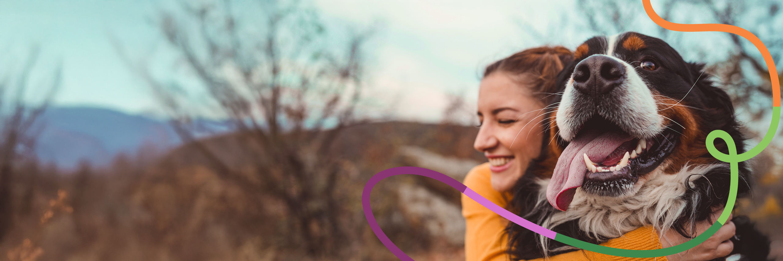 A woman hugging a dog