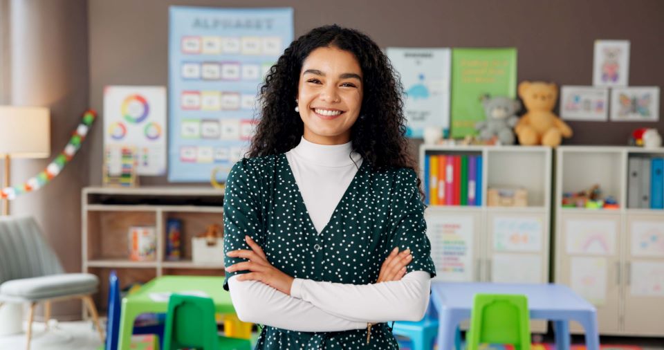 Woman, teacher and portrait in classroom