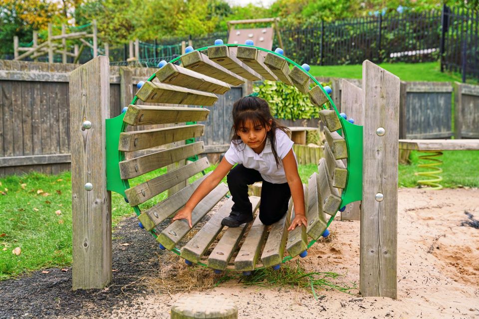 images/Child balancing through tunnel