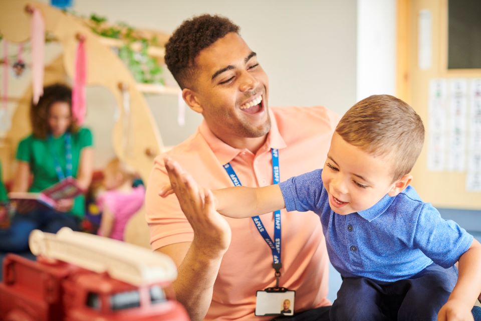 Nursery teacher with student