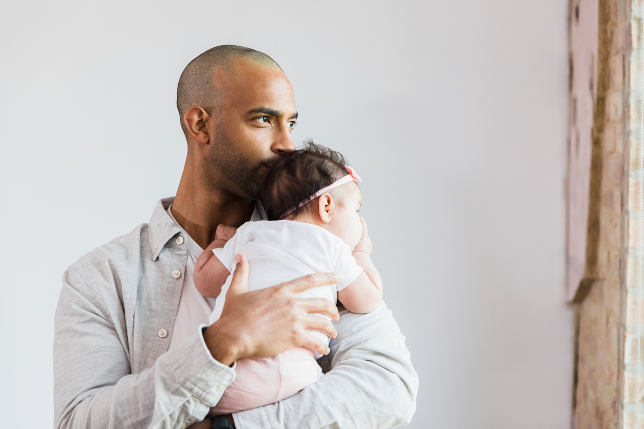 man holding a baby.