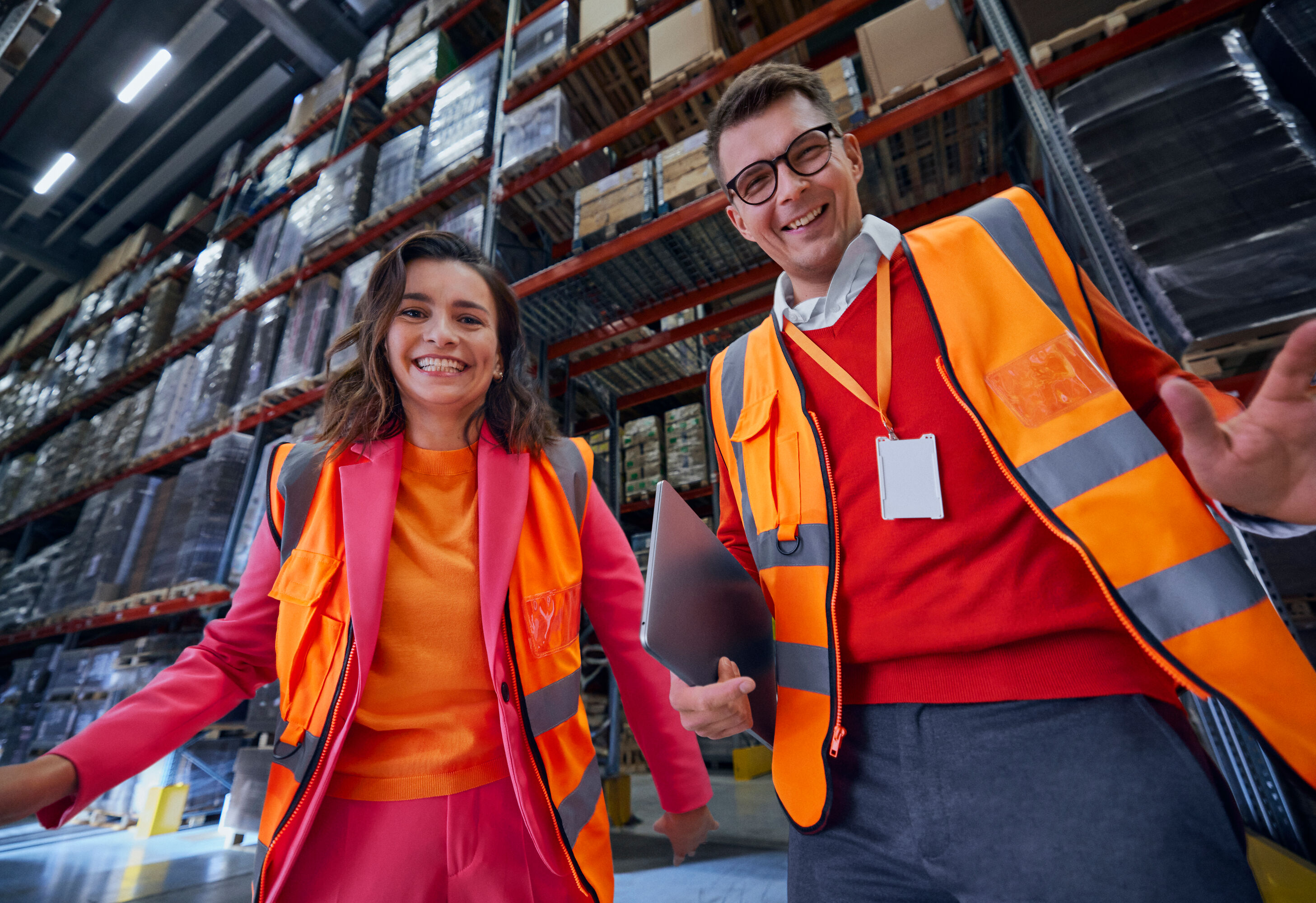 Man and woman inspecting a warehouse