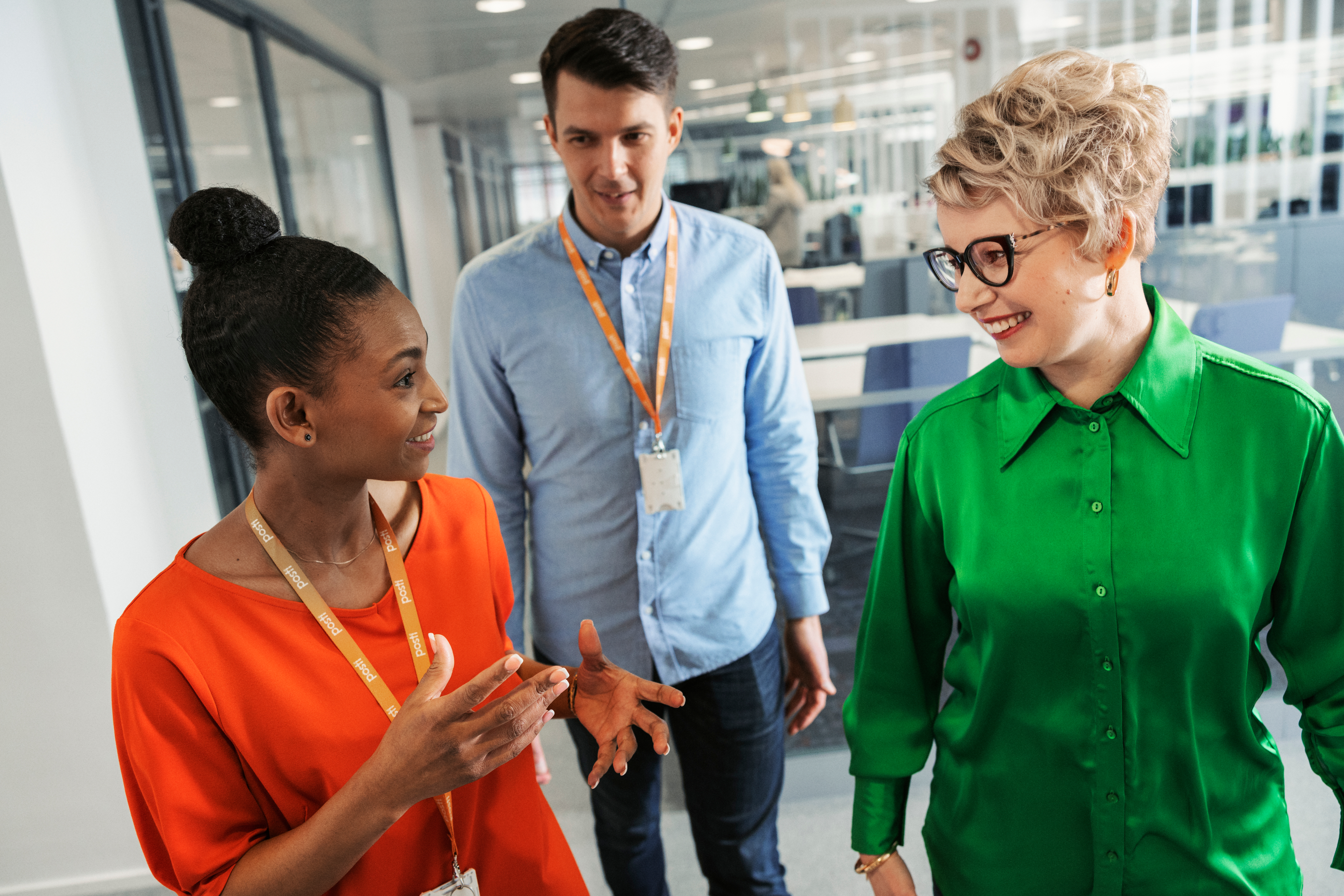 People at office smiling and talking