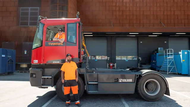 Two of Transval’s Logistics personnel next to transportation vehicle.