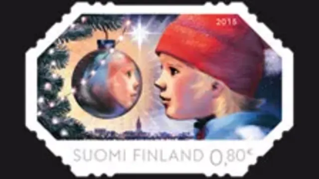The landscape-oriented stamp Reflection depicts a child looking at the reflection given off by a mirrored Christmas ornament.