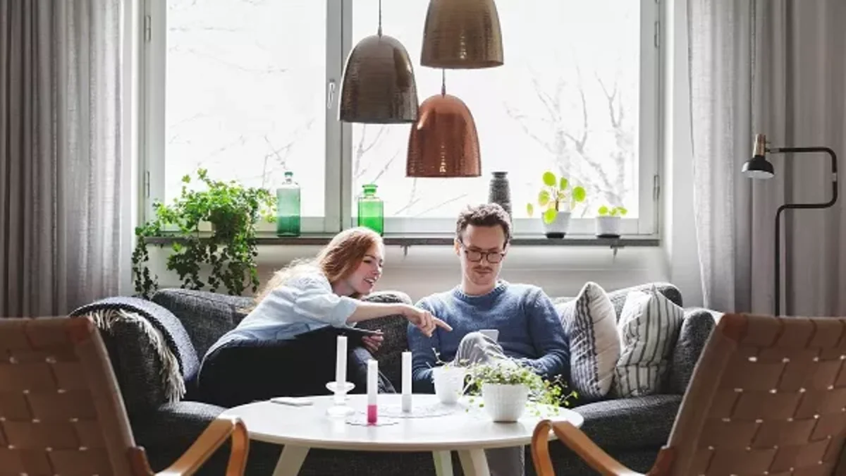A couple looks at the mobile phone