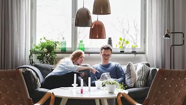 A couple looks at the mobile phone