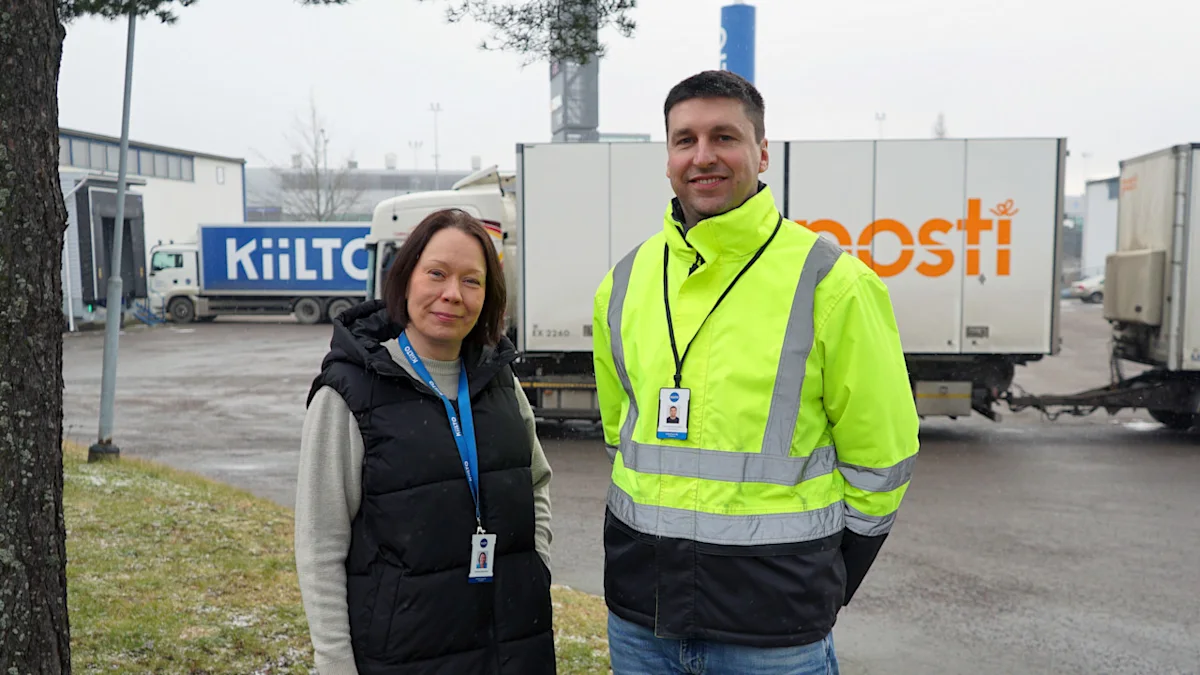 Kiilto personnel in from of Posti's freight truck