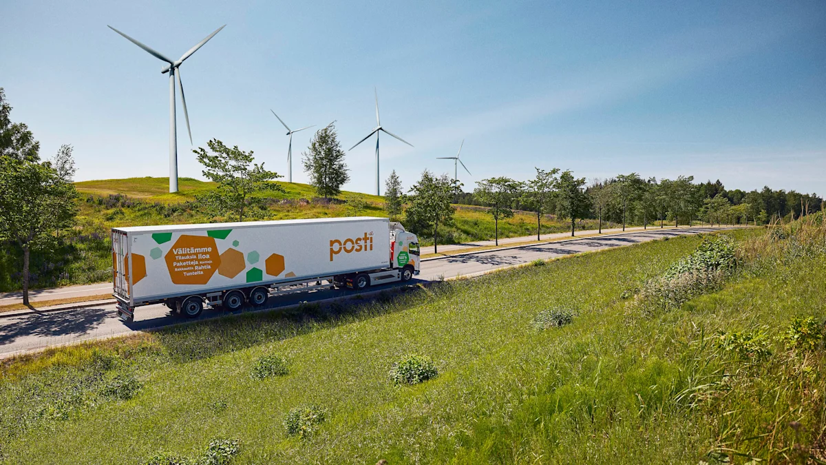 Posti truck on a road in summer with windmills in the background