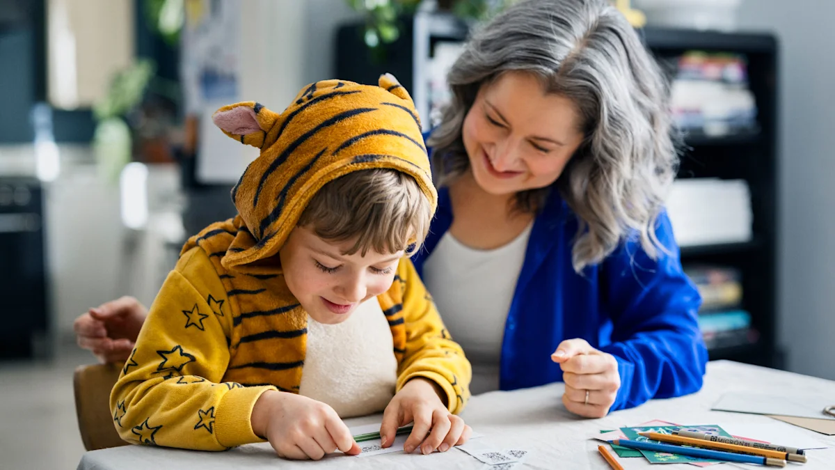 A child is putting a stamp on a letter.
