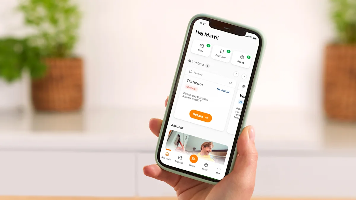 Med telefonen i handen