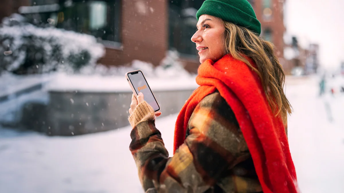 A woman with a phone in a winter landscape.