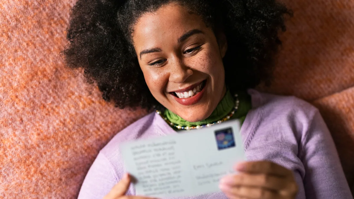 A happy woman is holding a postcard.