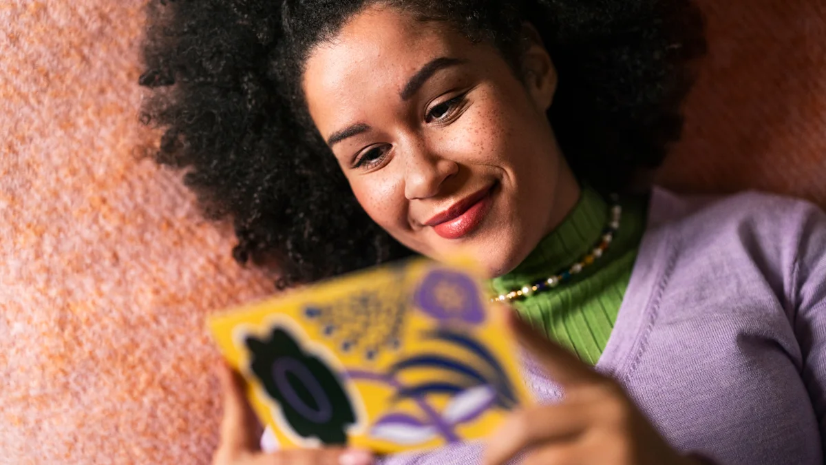 A woman reads a postcard with joy.