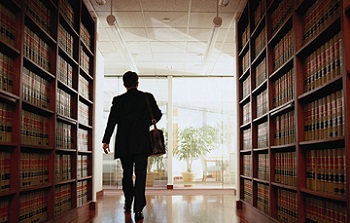 man walking through a law library