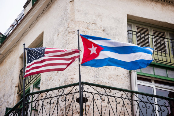 American and Cuban Flags flying outside a building