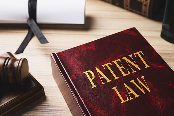 A law textbook with the words PATENT LAW on the front.