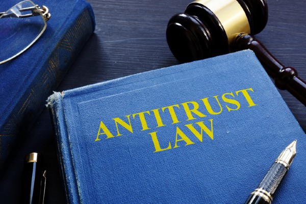 A law book is titled Antitrust Law.
