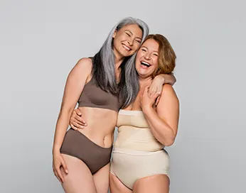 Two laughing middle-aged women
