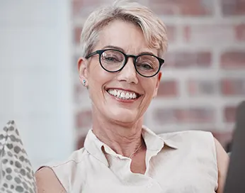 Smiling middle-aged woman with glasses