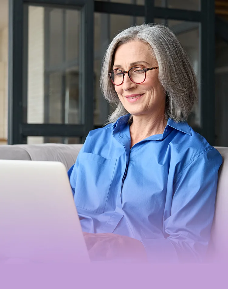 Smiling middle aged woman with laptop