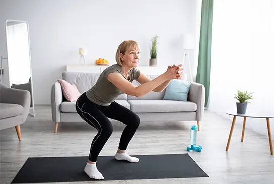 Woman doing pelvic floor exercises: Squats