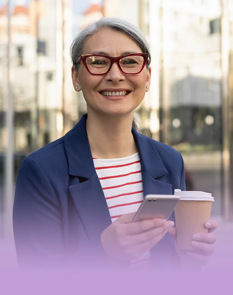 Smiling middle-aged woman with a phone in her hand