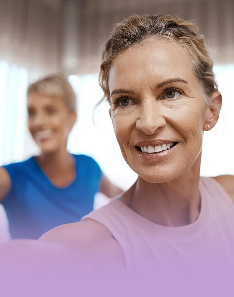 Smiling middle-aged woman doing exercise